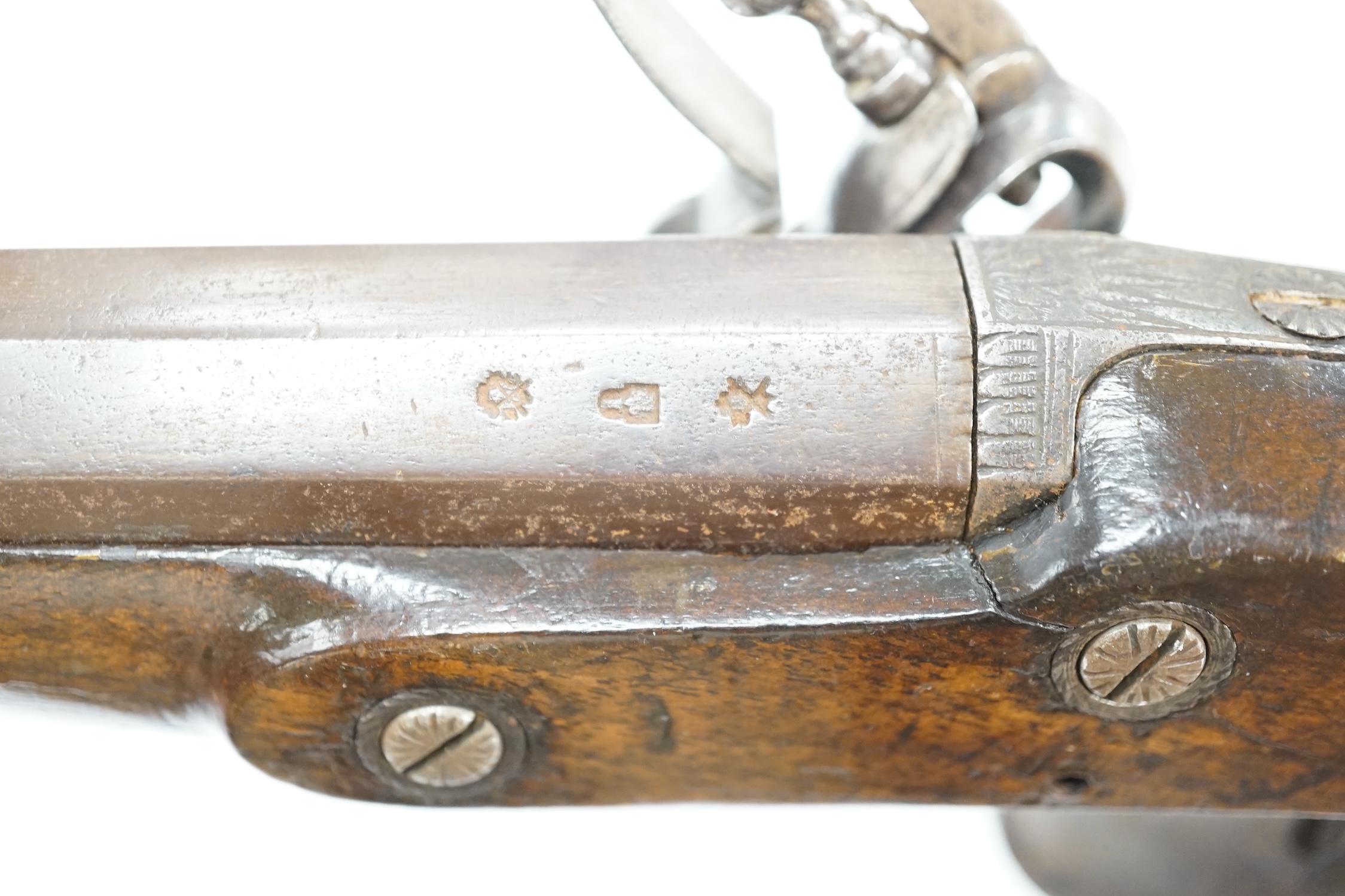 An early 19th century 12 bore fully stocked flintlock holster pistol, octagonal barrel with Birmingham proof marks, engraved iron trigger guard, iron tipped wooden ramrod, barrel 15.5cm. Condition - fair, cock replaced,